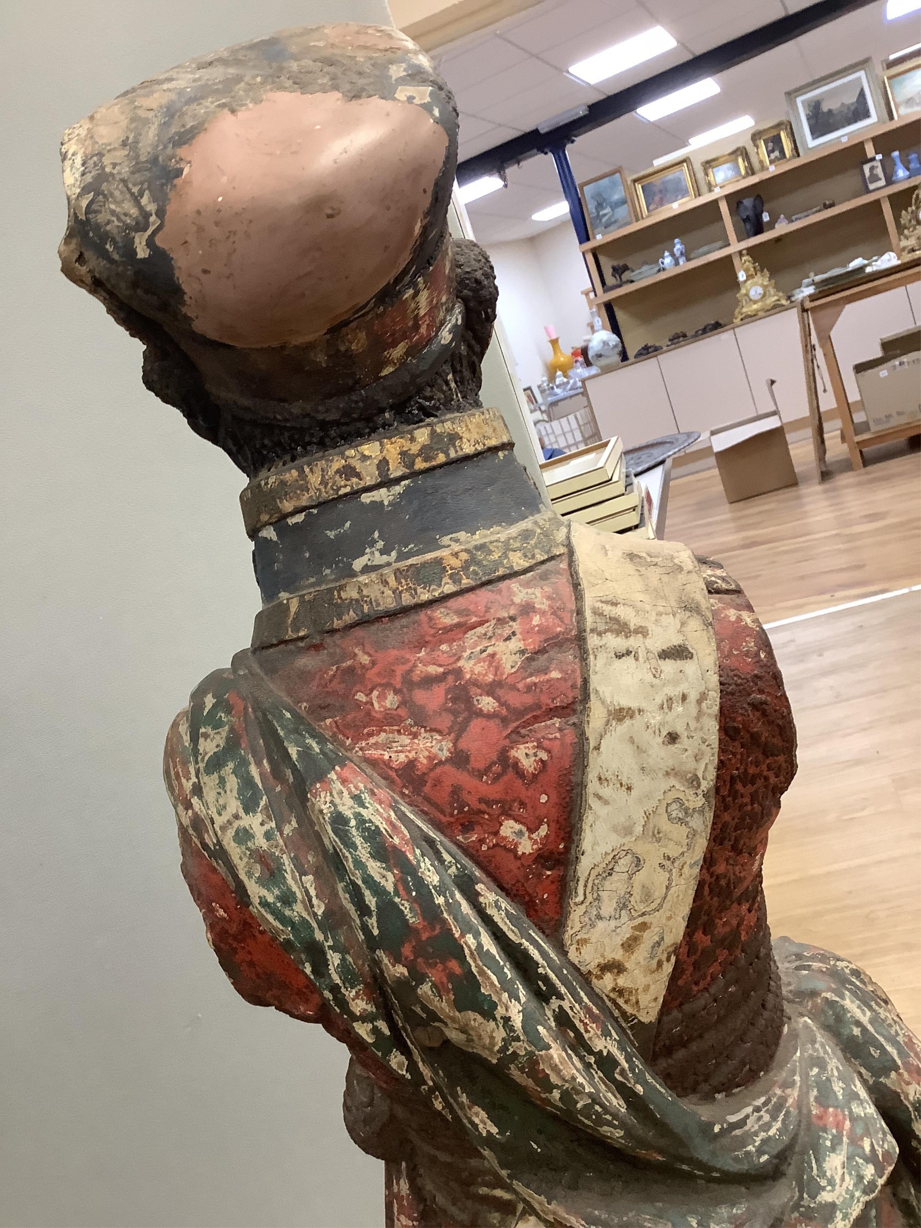 A large 19th century carved and painted Highlander ‘Snuff’ shop advertising figure. 109cm high. Condition - paint work and base weathered, arms detached.